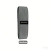A gray resistance band labeled Medium for glute and leg workouts.