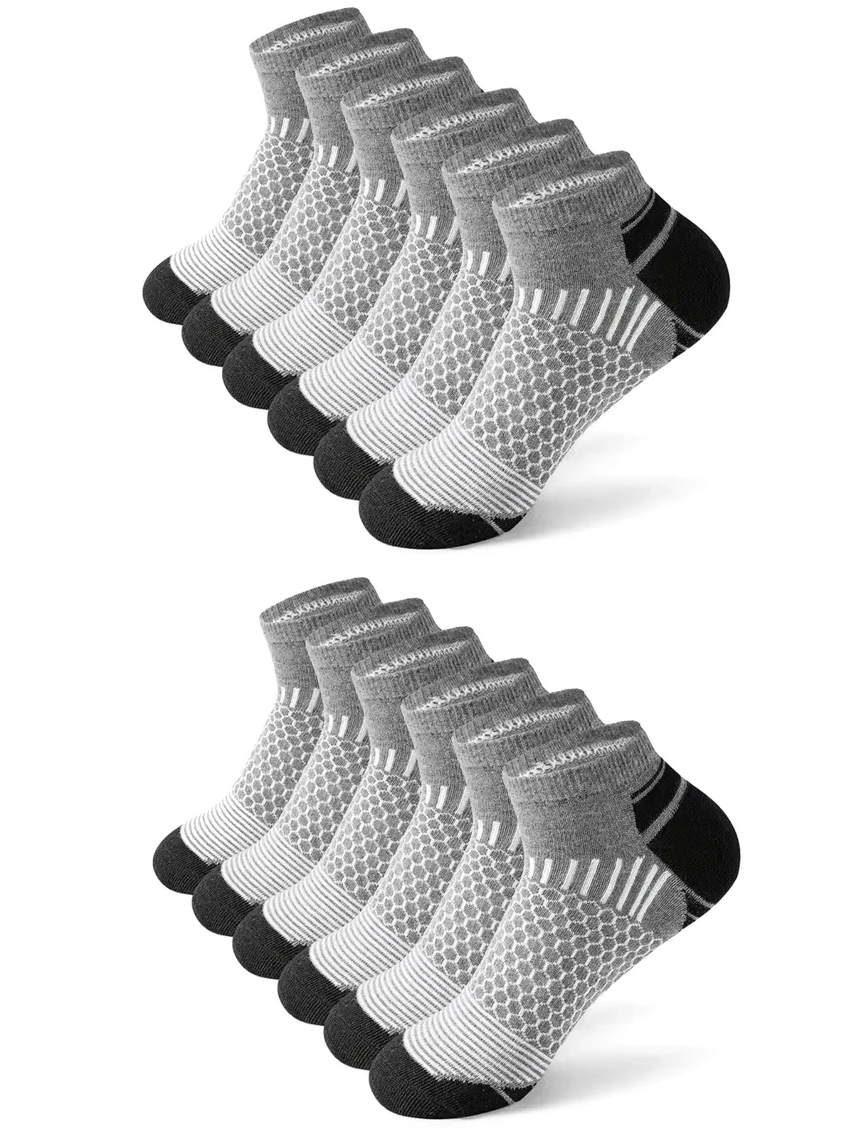 A stack of athletic knit ankle socks for men in various shades of gray and black.