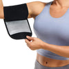 A woman is using a black and silver sweat shaper arm trimmer on her upper arm.