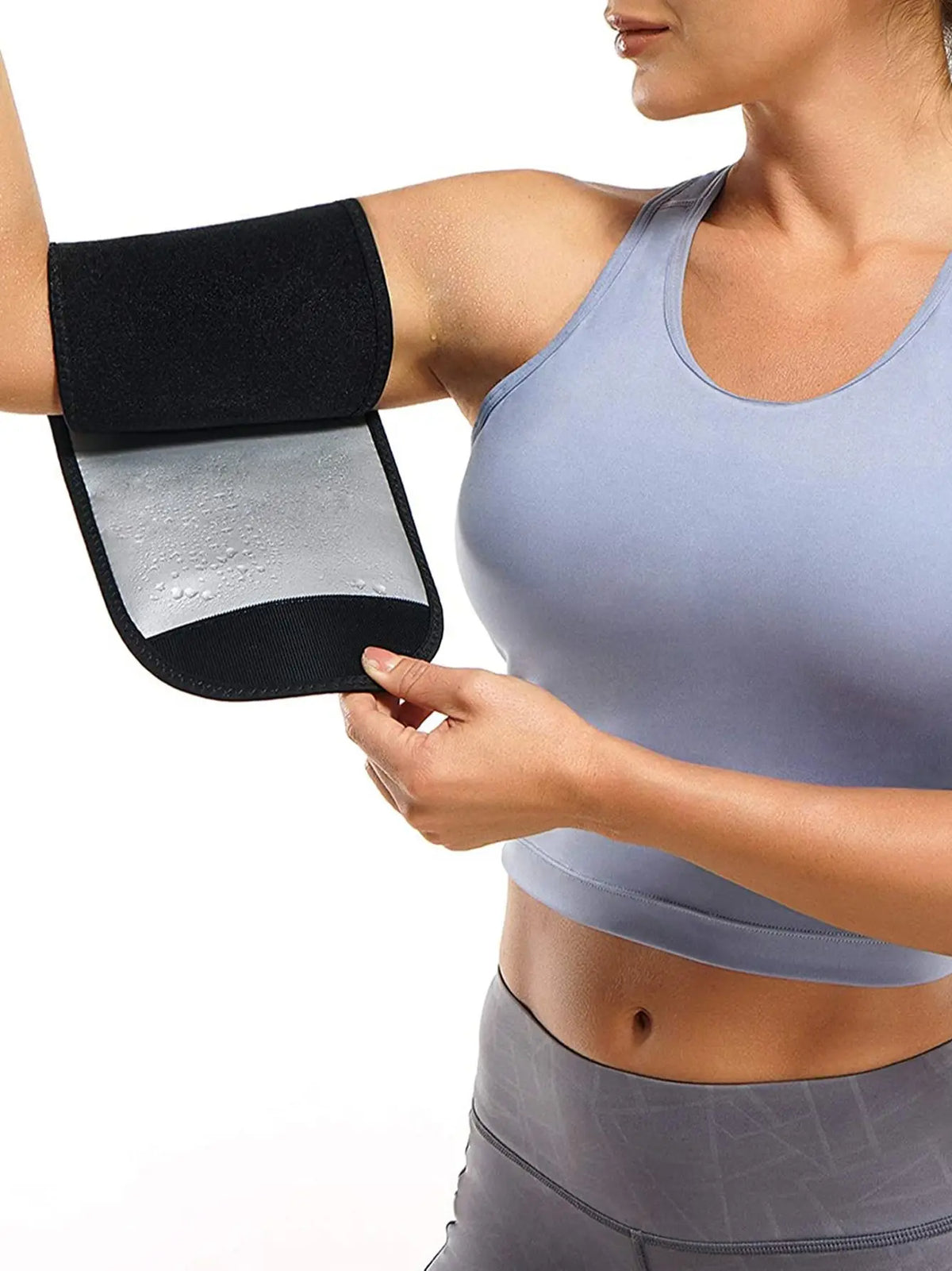 A woman is using a black and silver sweat shaper arm trimmer on her upper arm.