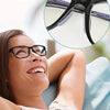 Close-up of black eyeglasses with silicone anti-slip nose pads shown on a woman's face.