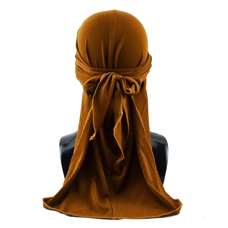 A brown men's distressed pirate style durag head wrap draped around a person's neck.