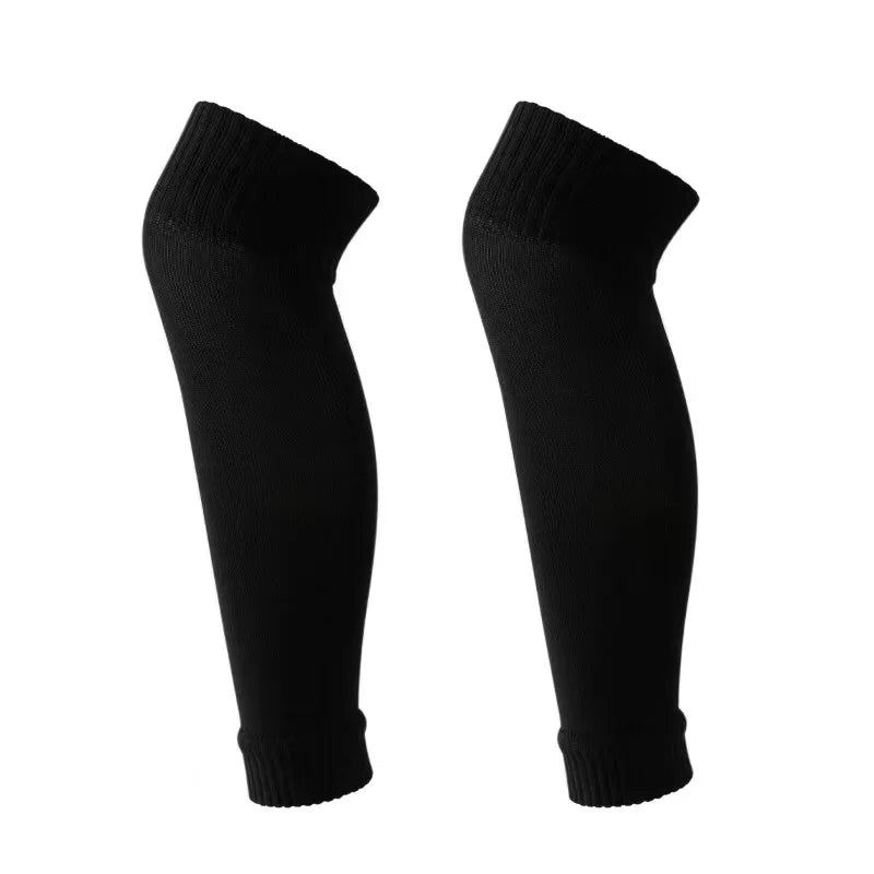A pair of black compression football socks for athletes.
