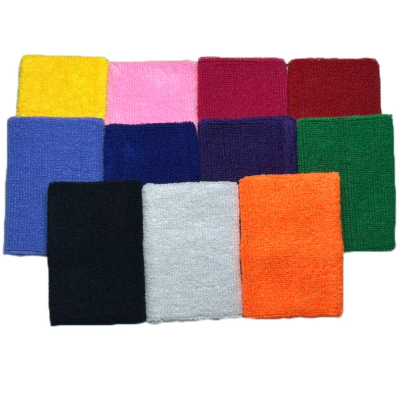 A collection of ten dual sports wristbands in various solid colors including yellow, pink, maroon, blue, purple, green, orang