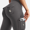 A close-up of a gray high-waisted flared fitness pant featuring multiple functional pockets.