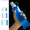 A hand holds a blue collapsible silicone hydration flask against a dark background.
