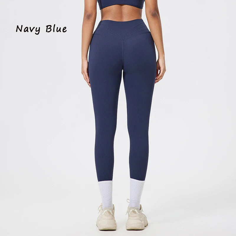 Marineblaue, nahtlose Yoga-Leggings mit hoher Taille, gezeigt an einem Modell.