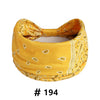 Yellow boho print cotton headband with yellow and white floral patterns