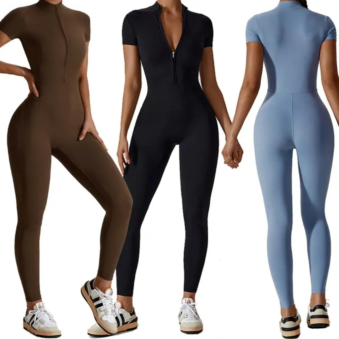 Three women wearing full-body, seamless yoga jumpsuits in brown, black, and light blue.