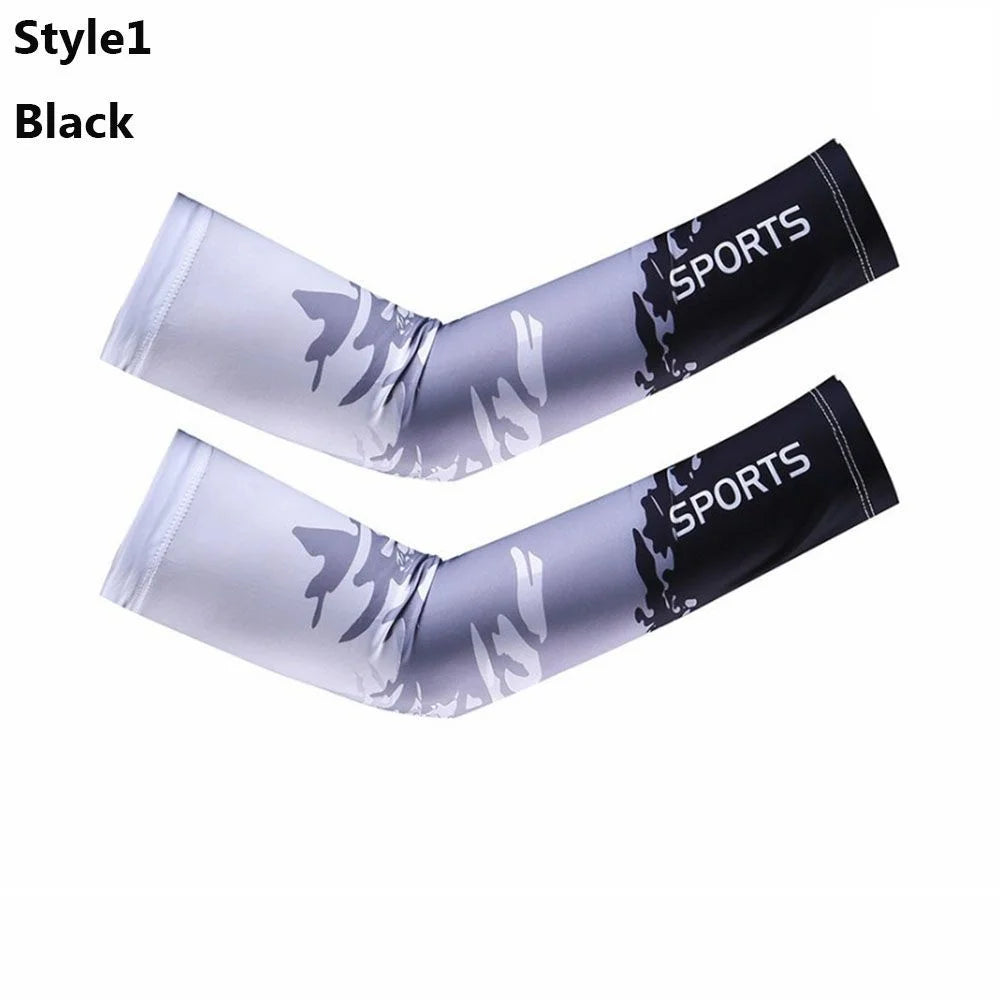 A pair of black sports arm sleeves with silver and black graphics shown against a white background.