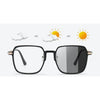 A pair of black photochromic blue light blocking glasses shown with sun icons indicating light sensitivity.