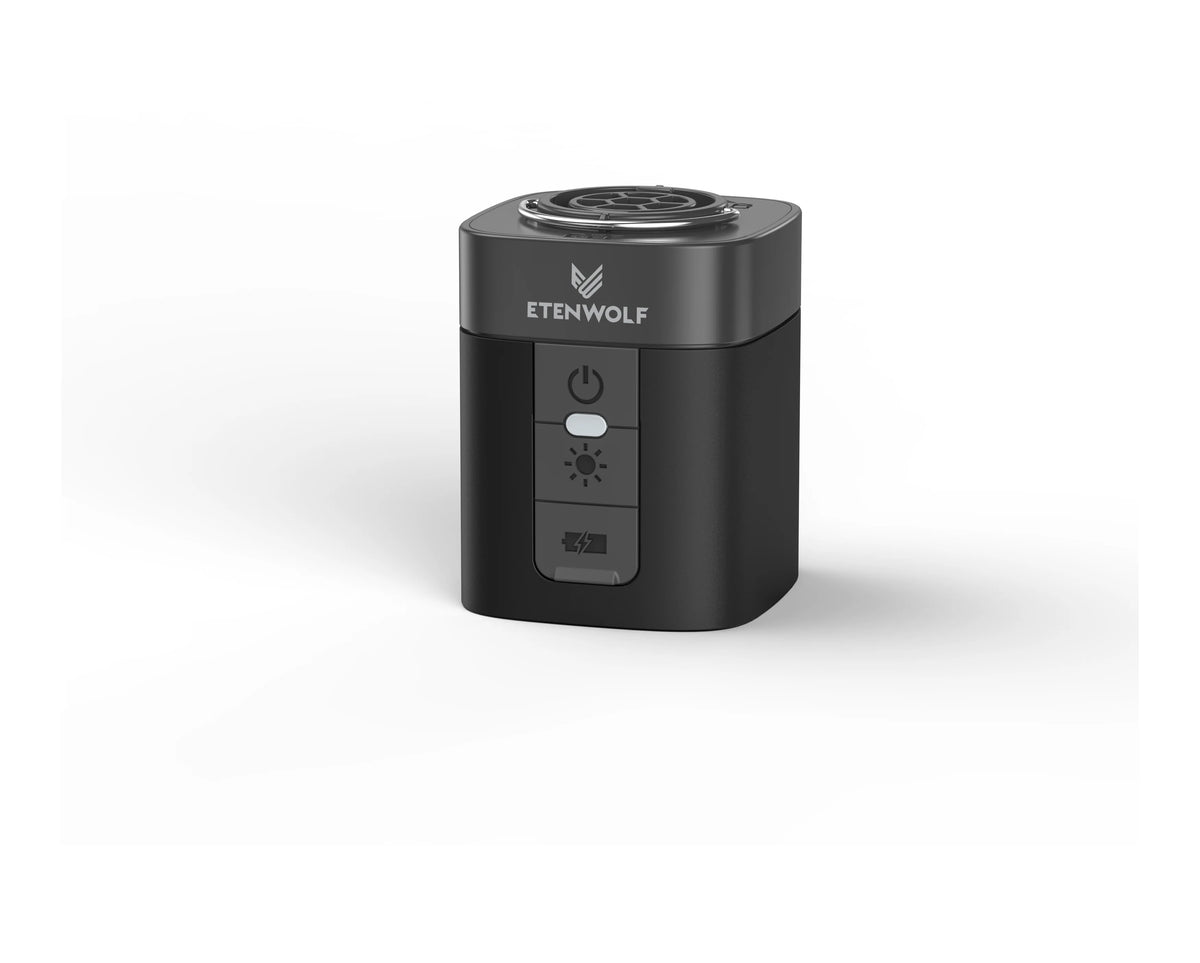A black portable electric air pump device with a power switch and indicator light.