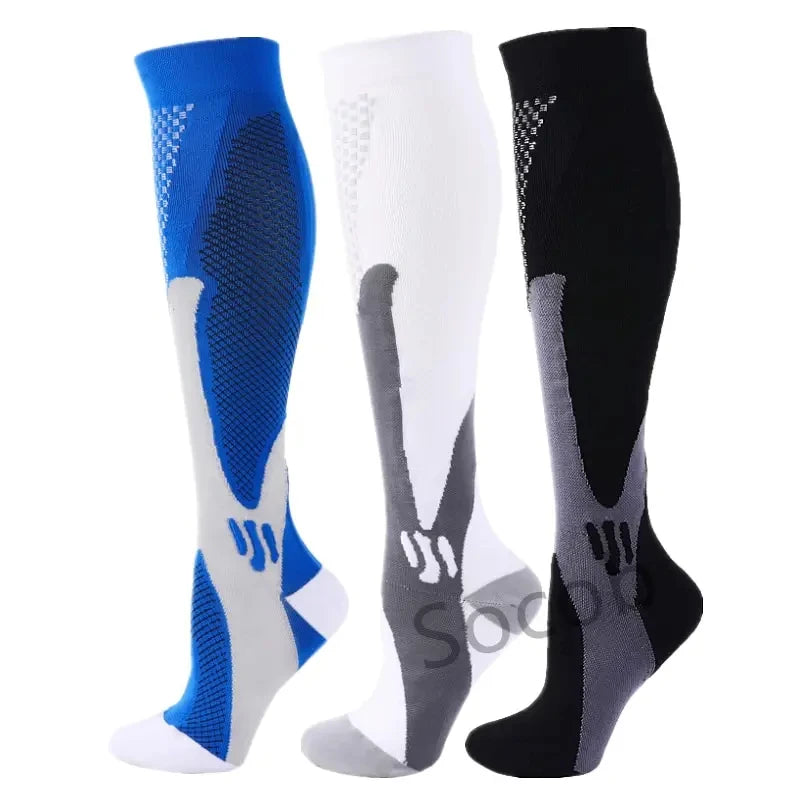 A set of three compression socks in blue, white, and black for athletes and medical use.