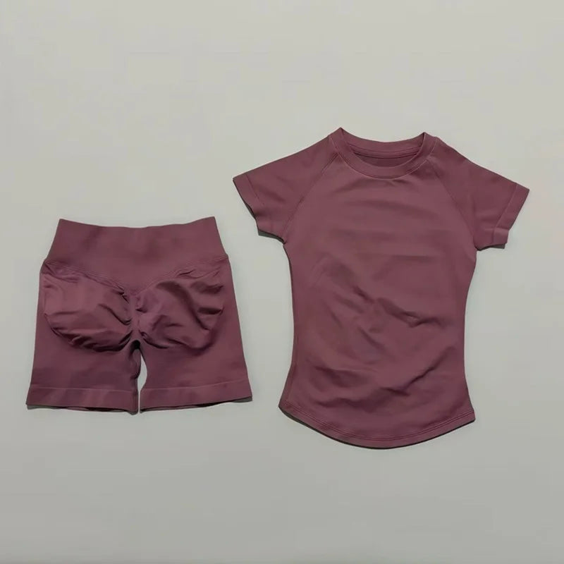 A mauve seamless yoga set for women featuring a short sleeve top and matching workout leggings.