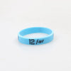 A light blue silicone wristband with the number 12 engraved on it.