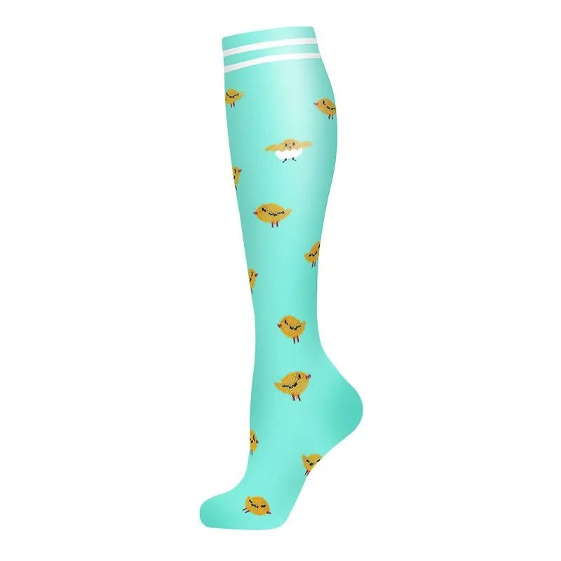 Light blue compression socks with a striped cuff featuring small animal designs.
