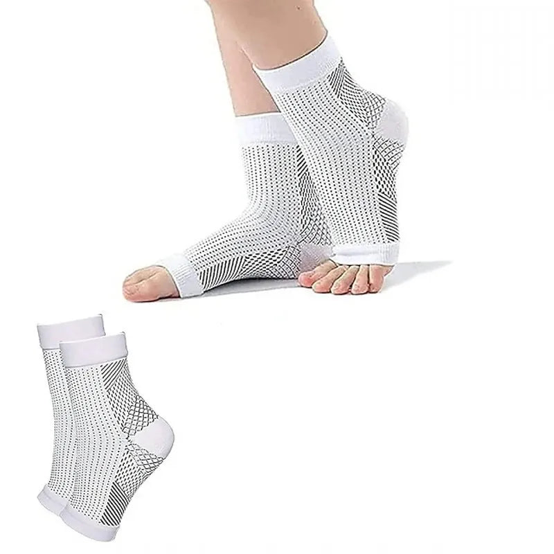 White ankle compression socks shown on a foot and leg.