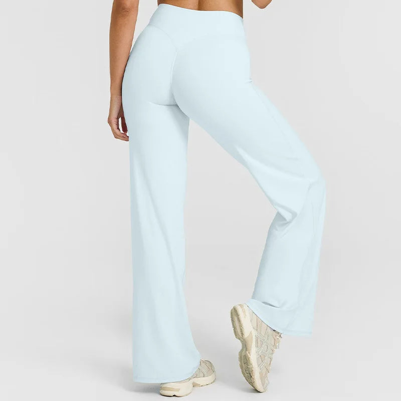 Light blue high-waist yoga pants worn by a person, shown from the side.