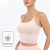A model wearing a light pink summer strappy yoga sports bra with built-in padding.