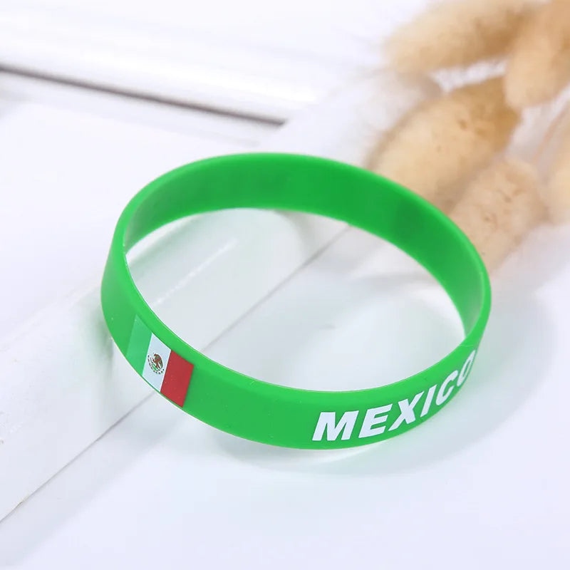 Green silicone wristband with the Mexican flag and the word MEXICO printed on it.
