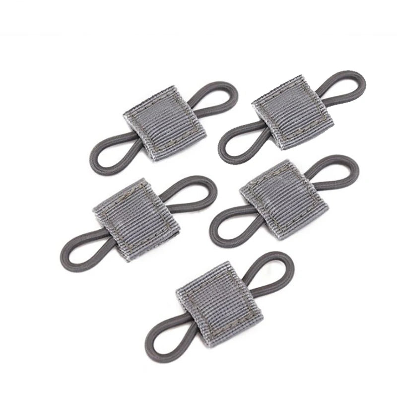 A multi-pack of gray tactical antenna binding buckles.