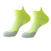 A pair of neon yellow breathable anti-blister running socks shown from the side.