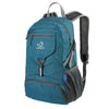 A teal foldable travel backpack with gray straps and pockets.