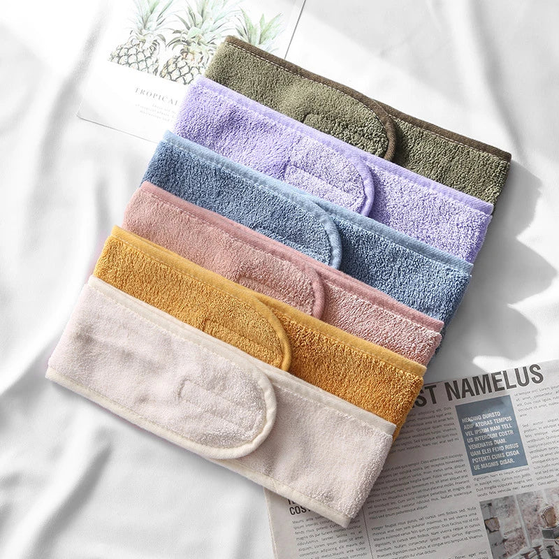 A stack of colorful faux fur and acrylic hair accessories in various pastel and earthy tones.