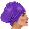 Purple silicone swim cap worn by a woman, showing its fit and texture.