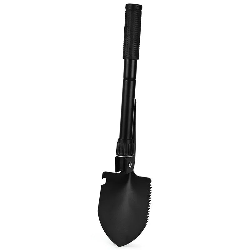 A black foldable multi-tool shovel with a textured handle and a curved blade.