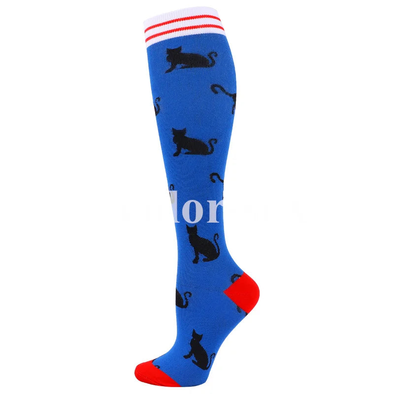 Blue compression socks with black cat patterns and red trim