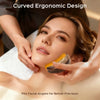 A woman is using a curved ergonomic facial tool on her face for precision massage.
