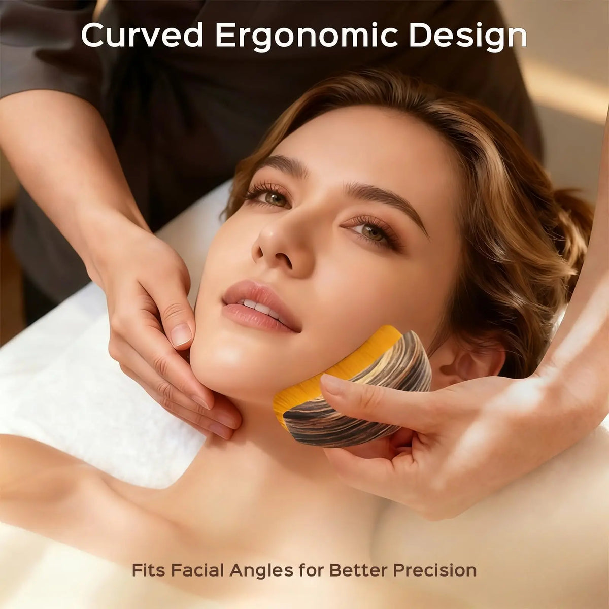 A woman is using a curved ergonomic facial tool on her face for precision massage.
