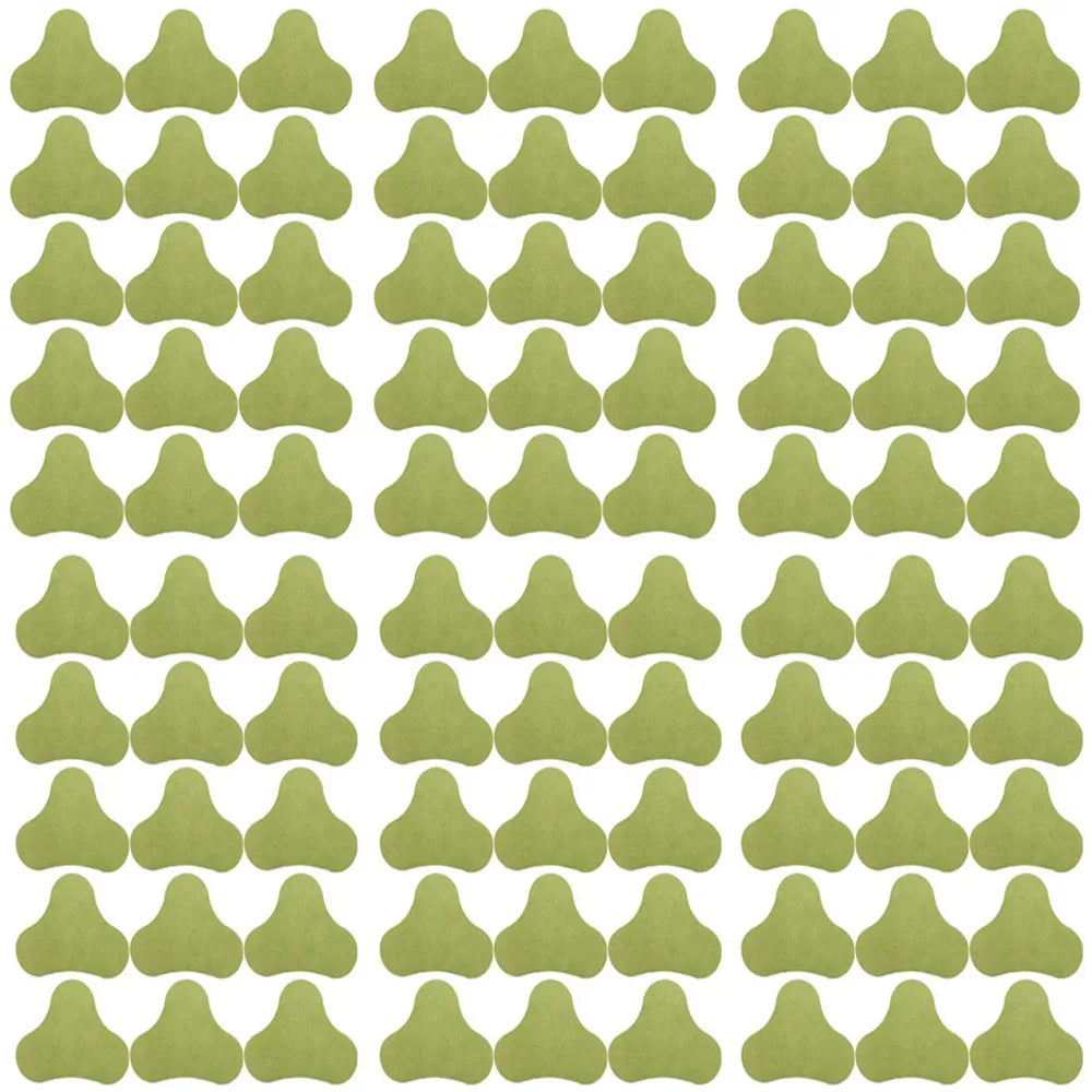 A grid of light green acupuncture heat patches shaped like stylized leaves for knee relief.