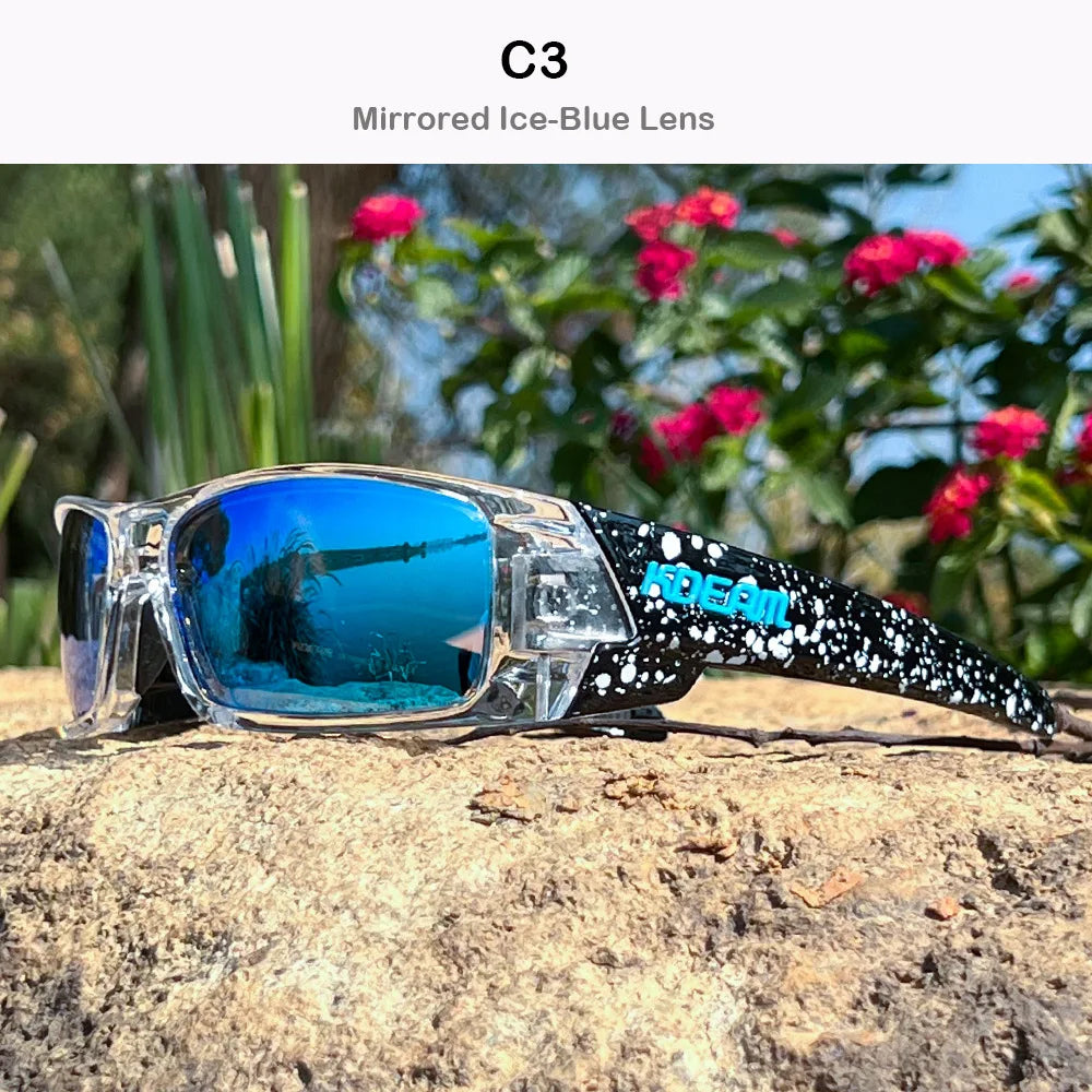 A pair of C3 mirrored ice-blue lens sunglasses resting on a rough, light-colored rock outdoors.