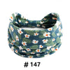 Tire-bande à motif floral bleu marine, noué en nœud.