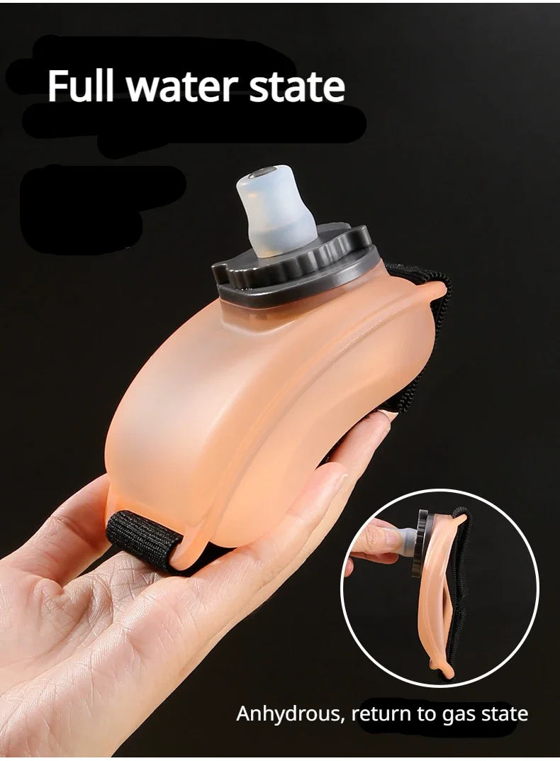 A hand holds a translucent orange sports water bottle in a full water state, demonstrating its ability to return to a gas sta