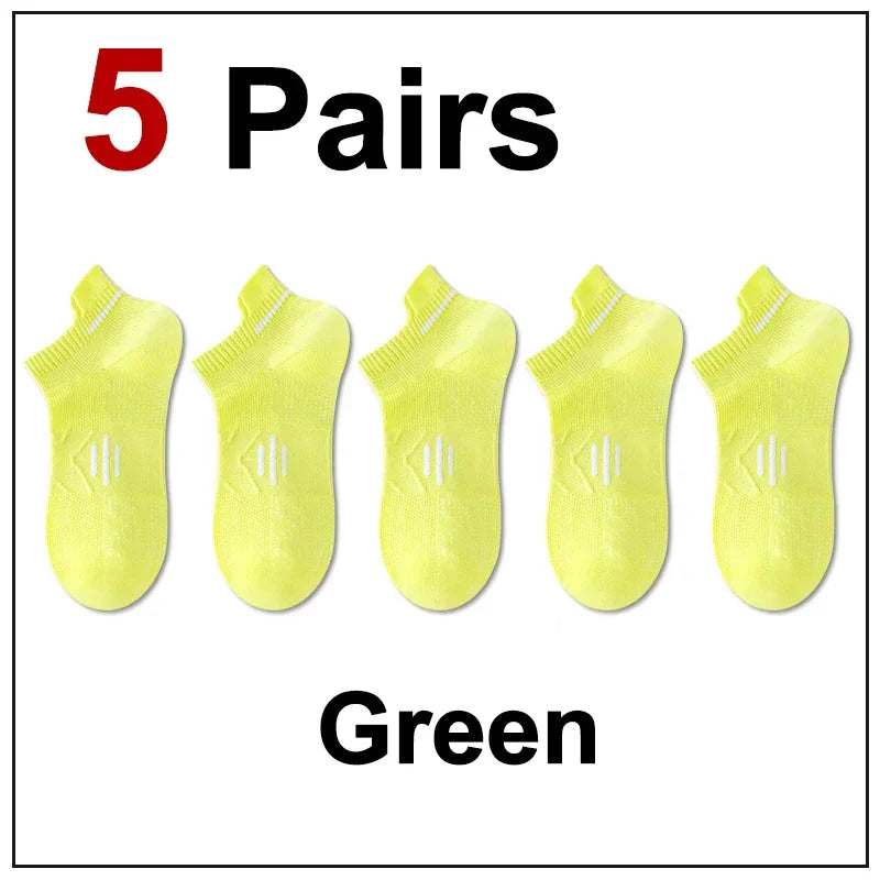 Five pairs of bright green breathable men's running socks displayed on a white background.