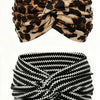 A black and tan leopard print fabric tied into a bandana or scrunchie.
