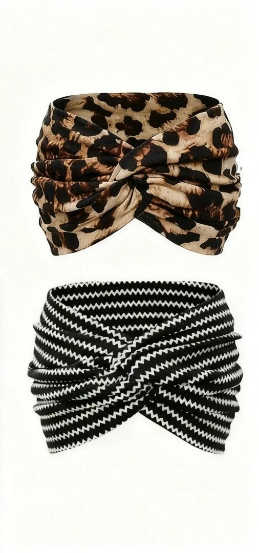 A black and tan leopard print fabric tied into a bandana or scrunchie.