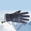 A dark blue extreme cold-proof ski glove is shown against a snowy mountain background.