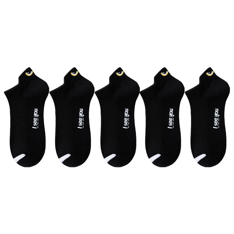 A set of five black men's breathable ankle boat socks with a yellow detail.