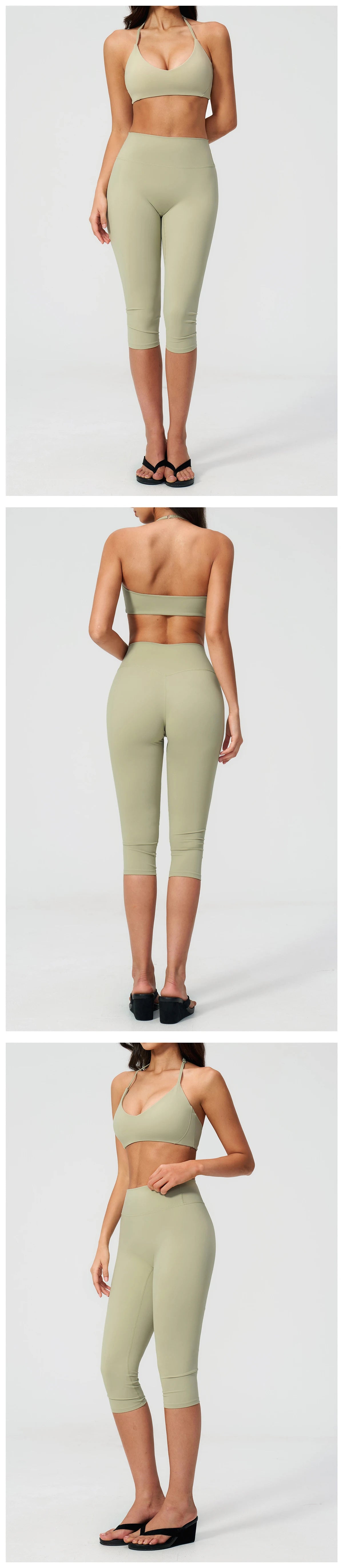 A woman models a light olive green women's premium fitness tracksuit consisting of a cropped top and fitted pants.
