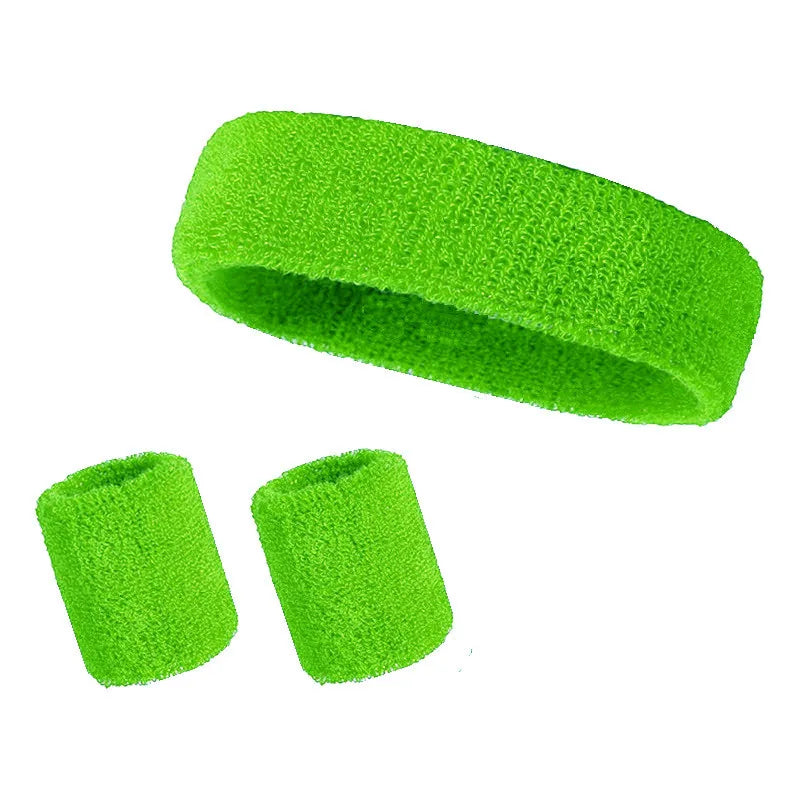 A set of three bright lime green athletic sweatbands or hairbands.