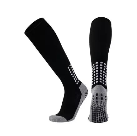 A pair of black and grey long football training socks for men