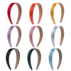A collection of nine solid satin hair bands in various colors including red, orange, gold, purple, pink, silver, black, and t