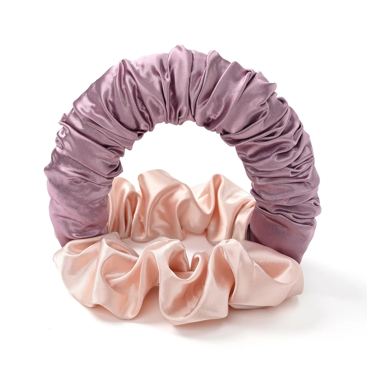 A purple satin heatless curling rod headband with pink fabric accents.