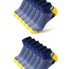A stack of navy blue athletic knit ankle socks with yellow accents, viewed from above.