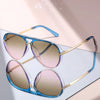 Pair of classic gradient aviator sunglasses with blue frames and rose gold accents