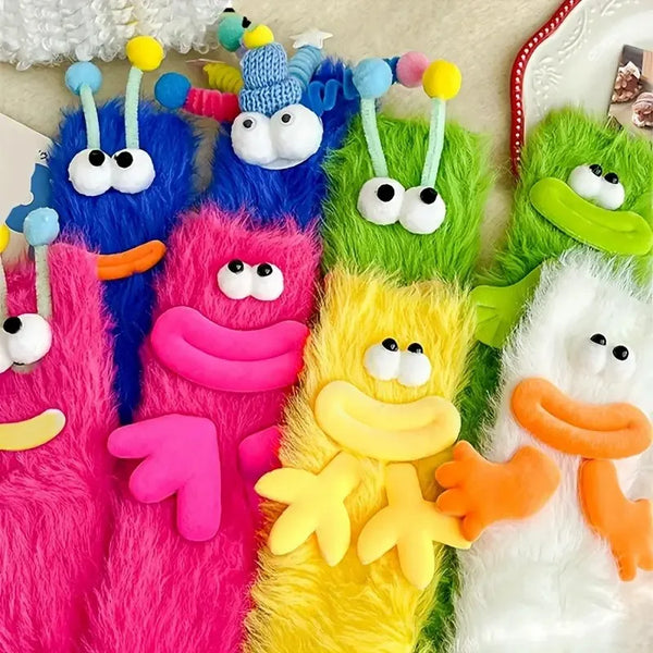 A set of colorful cartoon expression knit socks featuring bright pink, blue, purple, green, and yellow fuzzy toes.